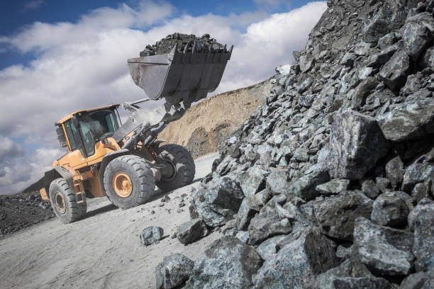 excavator loads its scoop with unworked mineral from stack excavator loads its scoop with unworked mineral from stack